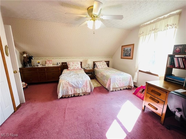 carpeted bedroom featuring lofted ceiling, a ceiling fan, and a textured ceiling