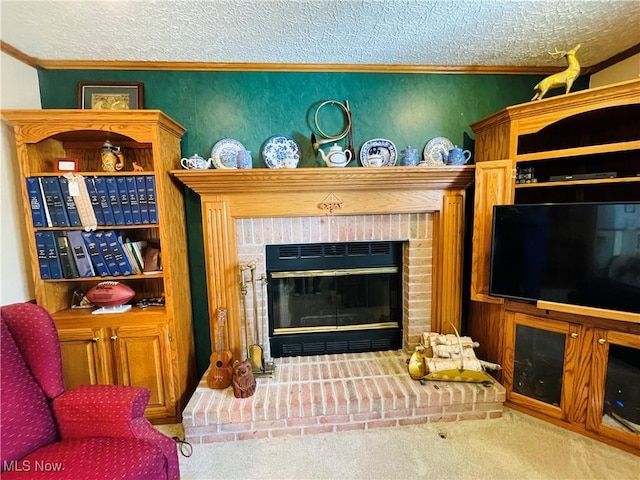 living area with a fireplace, carpet floors, a textured ceiling, and ornamental molding