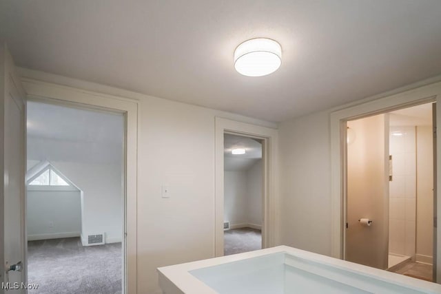 interior space with visible vents, carpet flooring, and baseboards