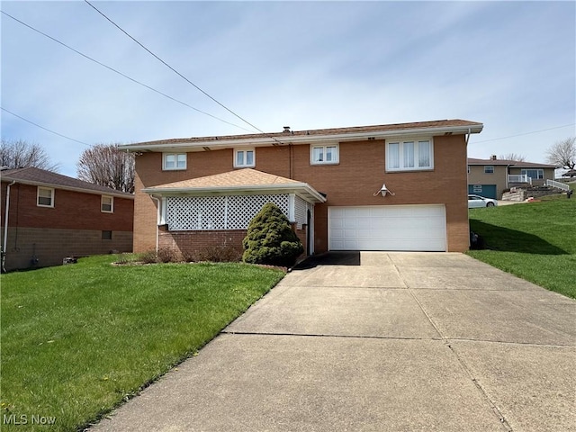 traditional-style house with an attached garage, brick siding, a front yard, and concrete driveway