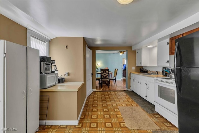 kitchen with white cabinetry, a sink, white appliances, and light countertops