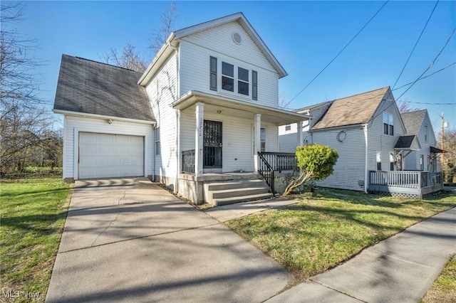 view of front of house featuring a front lawn, an attached garage, concrete driveway, and covered porch
