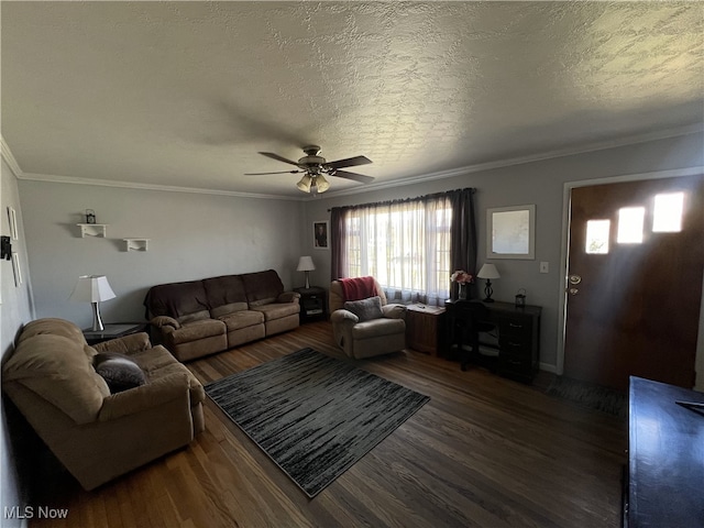living area with a ceiling fan, wood finished floors, a textured ceiling, and crown molding