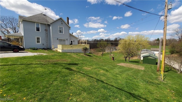 59011 Cherry Hill Rd, Byesville, OH 43723 - view of grassy yard with a deck and a storage shed