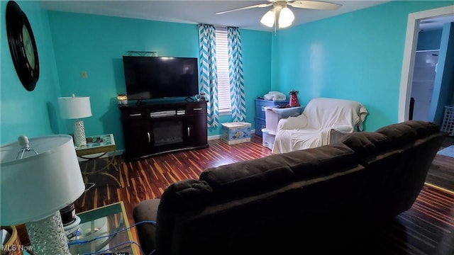 59011 Cherry Hill Rd, Byesville, OH 43723 - living room featuring a ceiling fan, wood finished floors, and baseboards