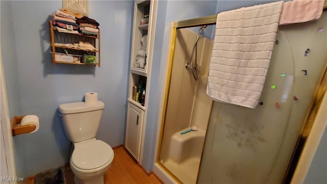 59011 Cherry Hill Rd, Byesville, OH 43723 - bathroom featuring a stall shower, wood finished floors, and toilet