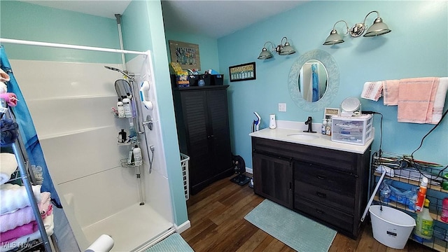 59011 Cherry Hill Rd, Byesville, OH 43723 - full bath featuring wood finished floors, a stall shower, and vanity
