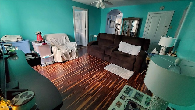 59011 Cherry Hill Rd, Byesville, OH 43723 - living room featuring wood finished floors, arched walkways, and ceiling fan
