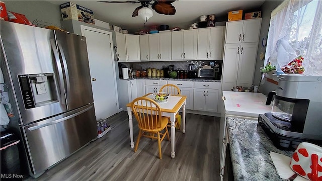 59011 Cherry Hill Rd, Byesville, OH 43723 - kitchen featuring stainless steel fridge with ice dispenser, wood finished floors, a ceiling fan, and healthy amount of natural light