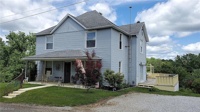59011 Cherry Hill Rd, Byesville, OH 43723 - view of front of house featuring a shingled roof, a wooden deck, a front yard, and a patio area
