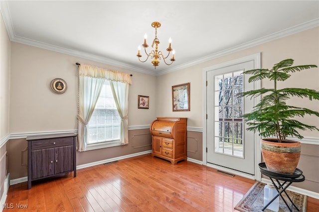 1332 Springbrook Dr, Mansfield, OH 44906 - interior space with visible vents, light wood-style floors, a chandelier, and ornamental molding