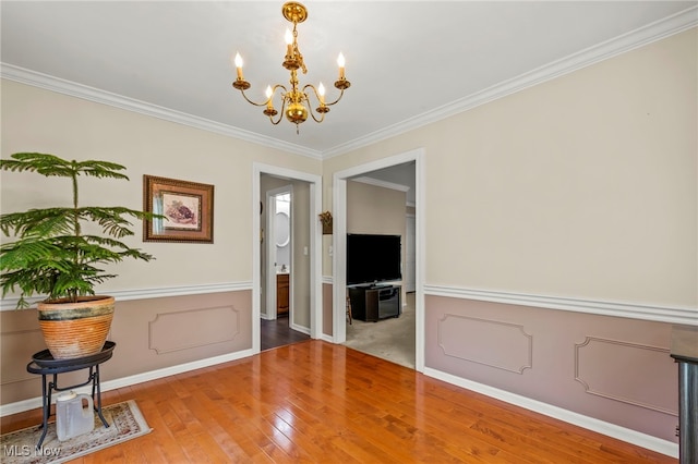 1332 Springbrook Dr, Mansfield, OH 44906 - interior space featuring wood-type flooring, crown molding, baseboards, and a notable chandelier
