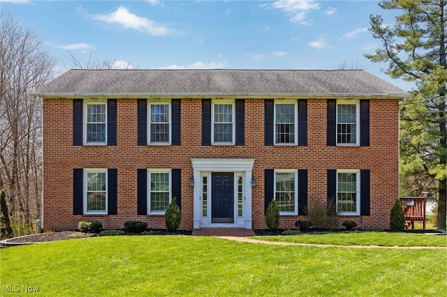 1332 Springbrook Dr, Mansfield, OH 44906 - colonial-style house featuring a front lawn, brick siding, and roof with shingles