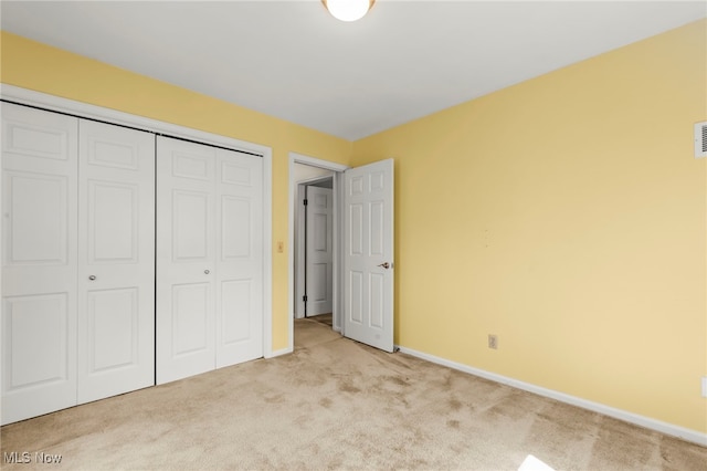 1332 Springbrook Dr, Mansfield, OH 44906 - unfurnished bedroom featuring a closet, carpet flooring, baseboards, and visible vents