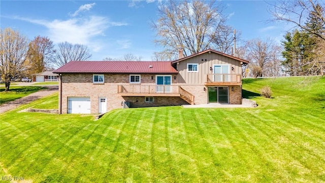 3604 Eldersville Rd, Colliers, WV 26035 - back of house featuring brick siding, an attached garage, metal roof, and a lawn