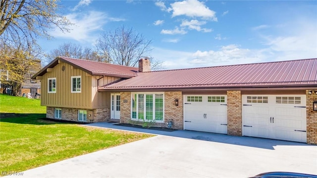 3604 Eldersville Rd, Colliers, WV 26035 - tri-level home with a chimney, metal roof, concrete driveway, brick siding, and an attached garage