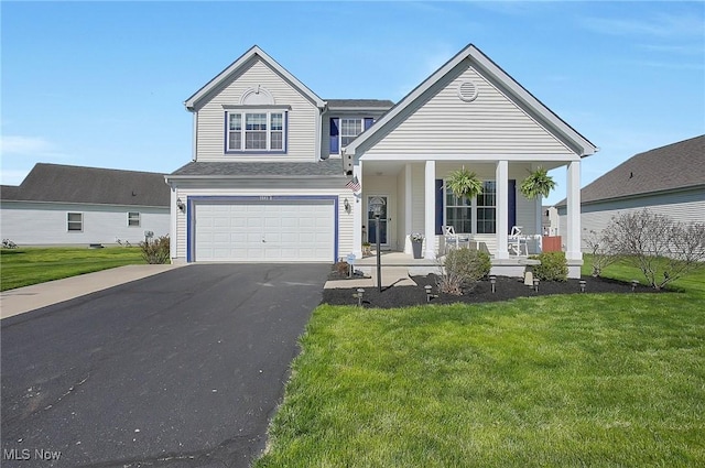 traditional-style house featuring an attached garage, a front yard, covered porch, and aphalt driveway