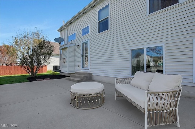 view of patio / terrace with an outdoor hangout area and fence