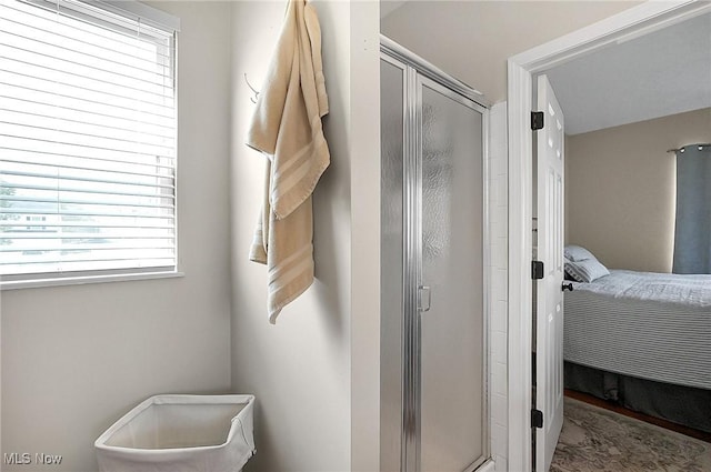 bathroom featuring plenty of natural light, ensuite bath, and a stall shower
