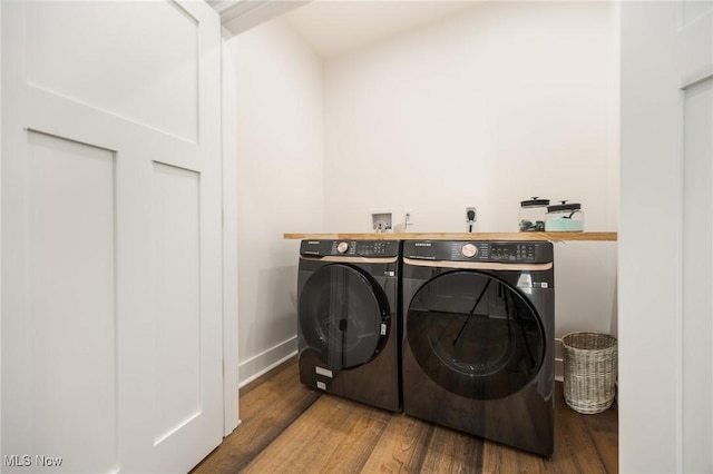1804 28th St, Vienna, WV 26105 - laundry room featuring baseboards, wood finished floors, washer and clothes dryer, and laundry area