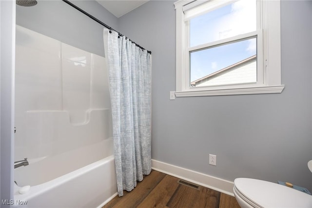 1804 28th St, Vienna, WV 26105 - full bathroom with toilet, visible vents, baseboards, shower / tub combo, and wood finished floors