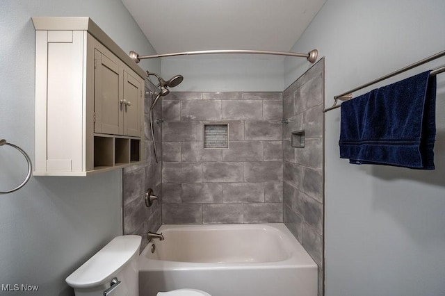 bathroom featuring toilet and tub / shower combination
