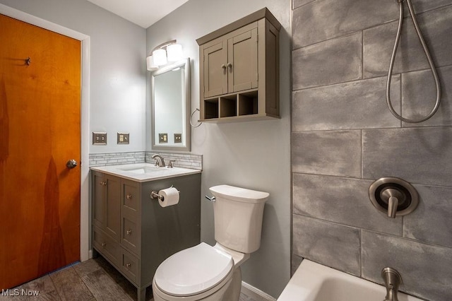 full bathroom with vanity and toilet
