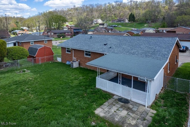 birds eye view of property with a residential view