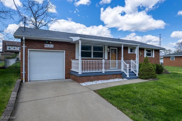 single story home with driveway, a porch, a garage, brick siding, and a front yard