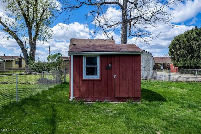 view of shed featuring a fenced backyard