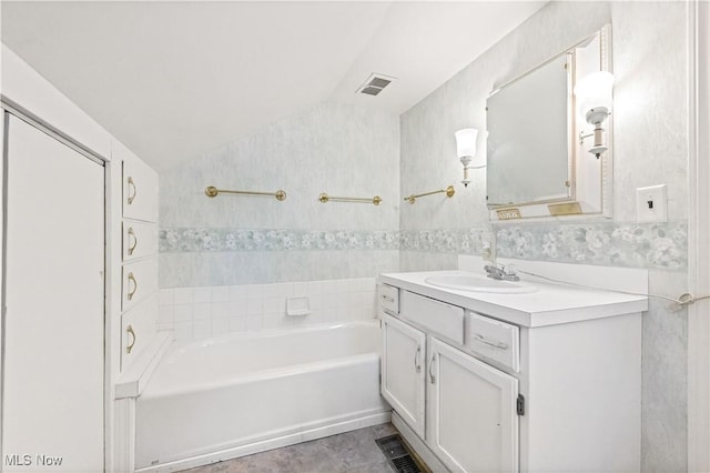 1611 Township Road 1610, Ashland, OH 44805 - bathroom with tile walls, vaulted ceiling, visible vents, shower / bath combination, and vanity