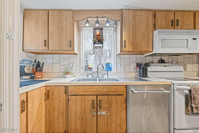 1611 Township Road 1610, Ashland, OH 44805 - kitchen featuring tasteful backsplash, a sink, white appliances, and light countertops