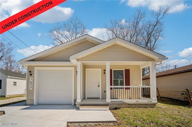 502 Fairlawn Ave, Painesville, OH 44077 - view of front facade with a garage, covered porch, and driveway