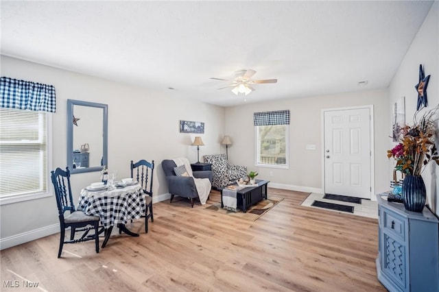 502 Fairlawn Ave, Painesville, OH 44077 - living room with light wood-type flooring, baseboards, and ceiling fan