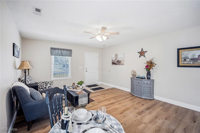 502 Fairlawn Ave, Painesville, OH 44077 - living area with light wood-style floors, visible vents, baseboards, and ceiling fan