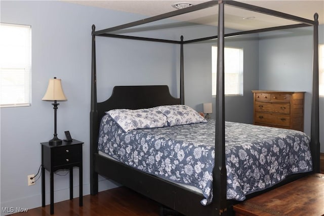 25900 Township Road 26, Coshocton, OH 43812 - bedroom featuring wood finished floors and multiple windows