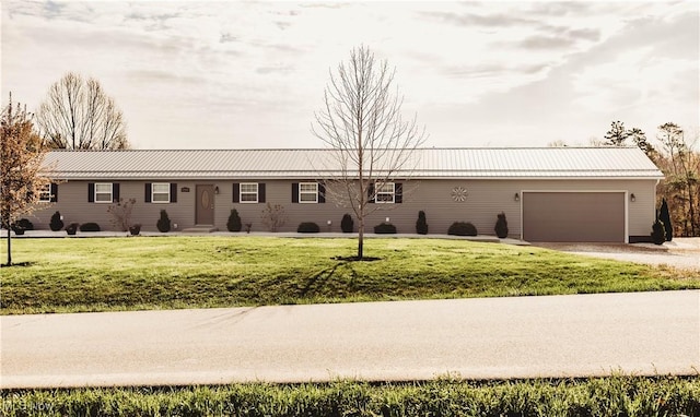 25900 Township Road 26, Coshocton, OH 43812 - ranch-style home with driveway, metal roof, a garage, entry steps, and a front yard