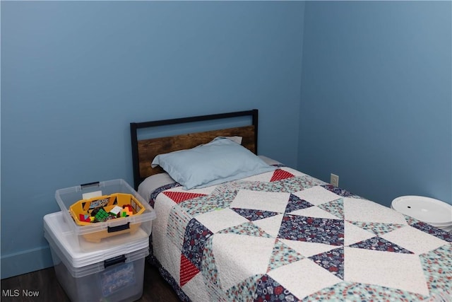 25900 Township Road 26, Coshocton, OH 43812 - bedroom featuring baseboards and wood finished floors