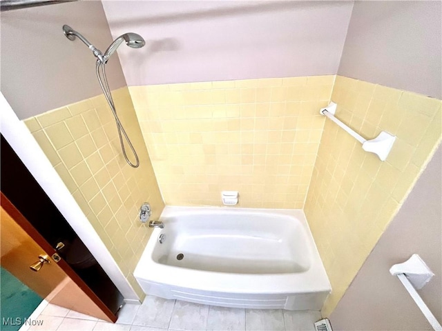 bathroom featuring tile patterned flooring and shower / bathing tub combination