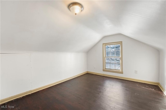 14221 S Woodland Rd, Shaker Heights, OH 44120 - additional living space featuring vaulted ceiling, dark wood-style floors, and baseboards