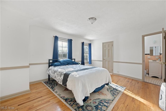 14221 S Woodland Rd, Shaker Heights, OH 44120 - bedroom featuring baseboards and wood finished floors
