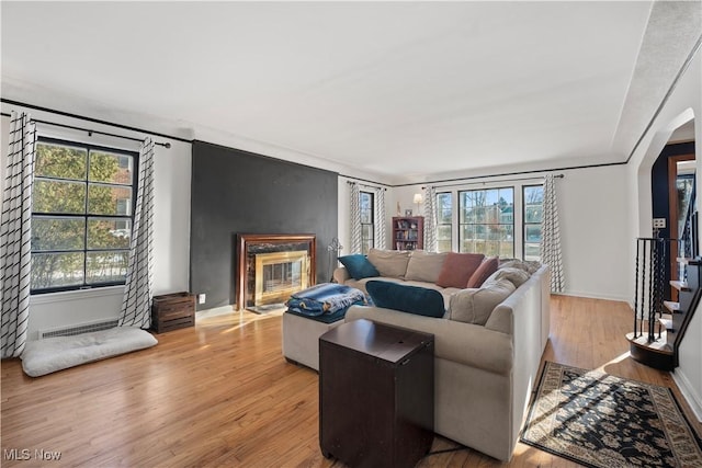 14221 S Woodland Rd, Shaker Heights, OH 44120 - living room with visible vents, wood finished floors, a premium fireplace, and plenty of natural light