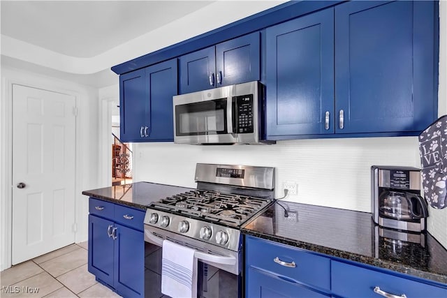 14221 S Woodland Rd, Shaker Heights, OH 44120 - kitchen with dark stone countertops, blue cabinetry, and stainless steel appliances