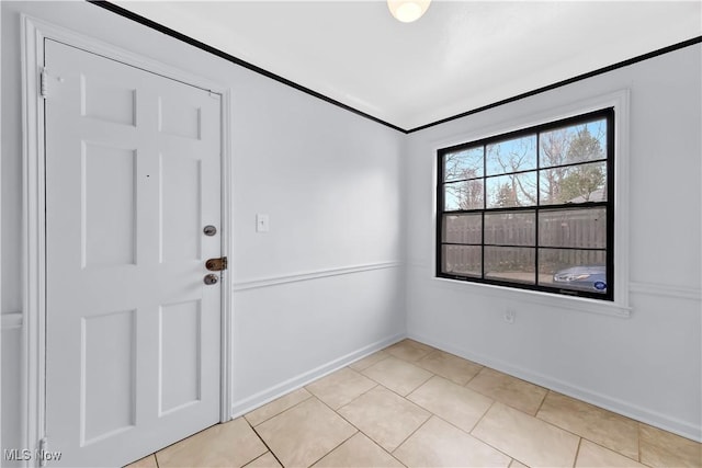 14221 S Woodland Rd, Shaker Heights, OH 44120 - spare room featuring light tile patterned floors and baseboards