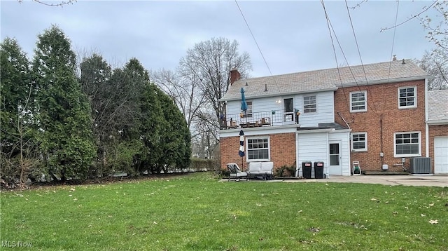 14221 S Woodland Rd, Shaker Heights, OH 44120 - rear view of property featuring central air condition unit, a balcony, a yard, a chimney, and brick siding