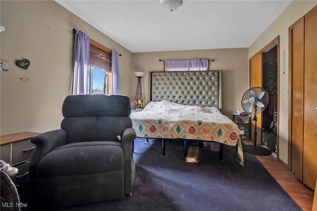 bedroom with wood finished floors
