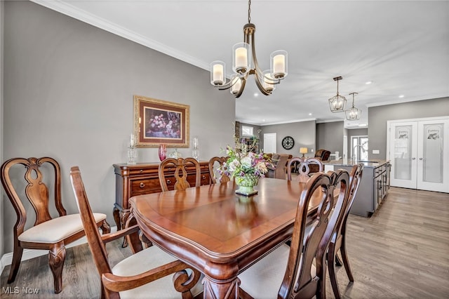 dining room with light wood finished floors, recessed lighting, and a healthy amount of sunlight