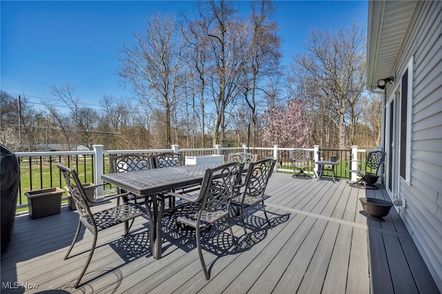 wooden deck featuring outdoor dining space