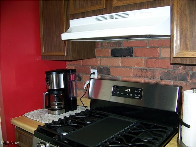 1239 Woodledge Dr, Mineral Ridge, OH 44440 - kitchen featuring stainless steel range with gas stovetop and under cabinet range hood