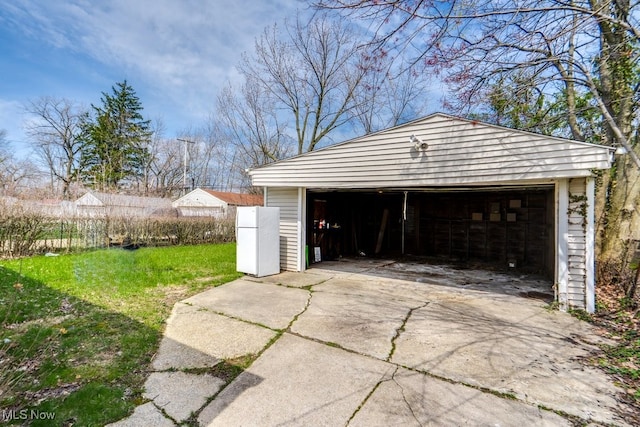 detached garage with freestanding refrigerator